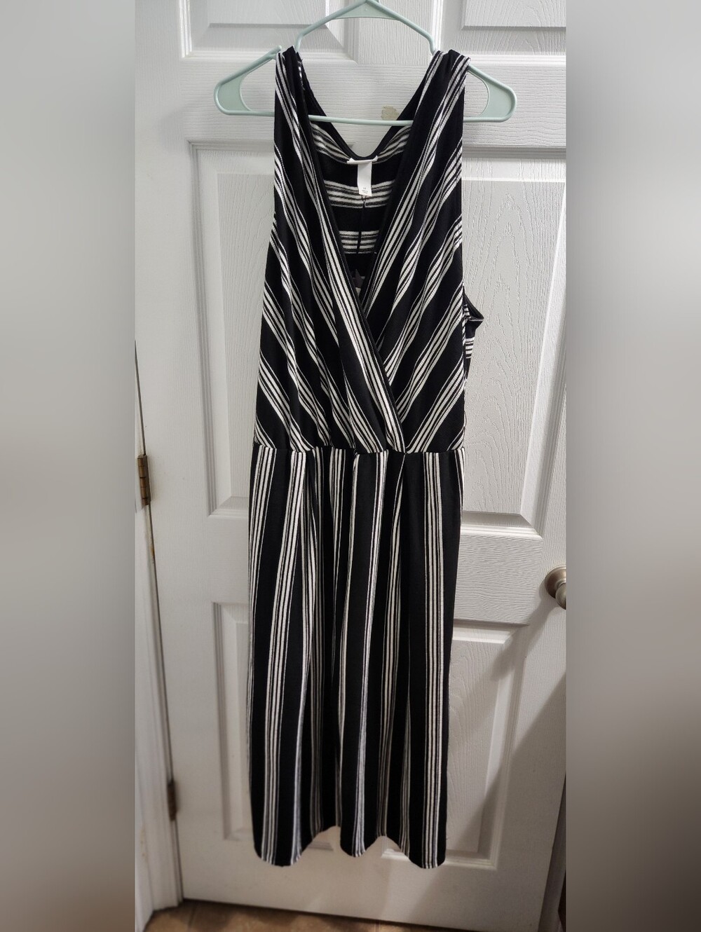 Black and White Striped Sleeveless Wrap Jumpsuit.
